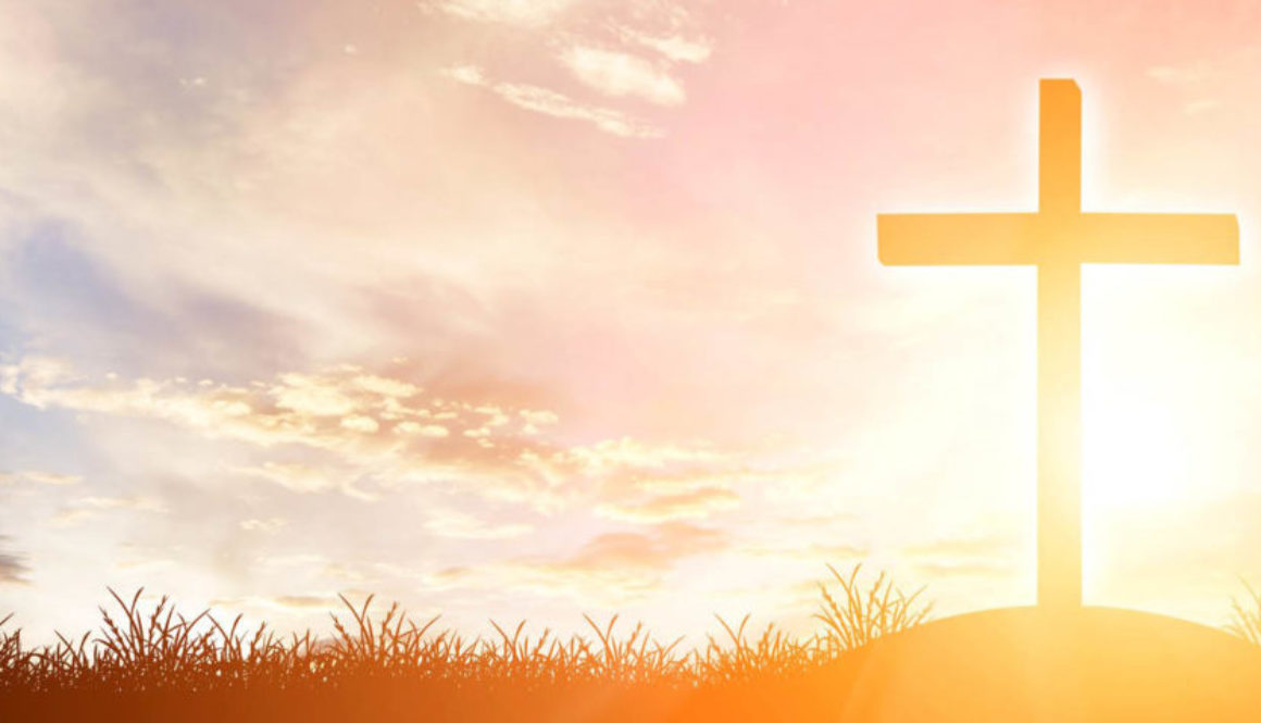 cross silhouette on the mountain at sunset